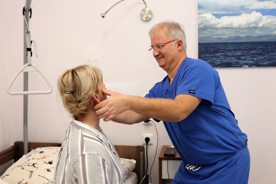 A patient having a pre-operative consultation